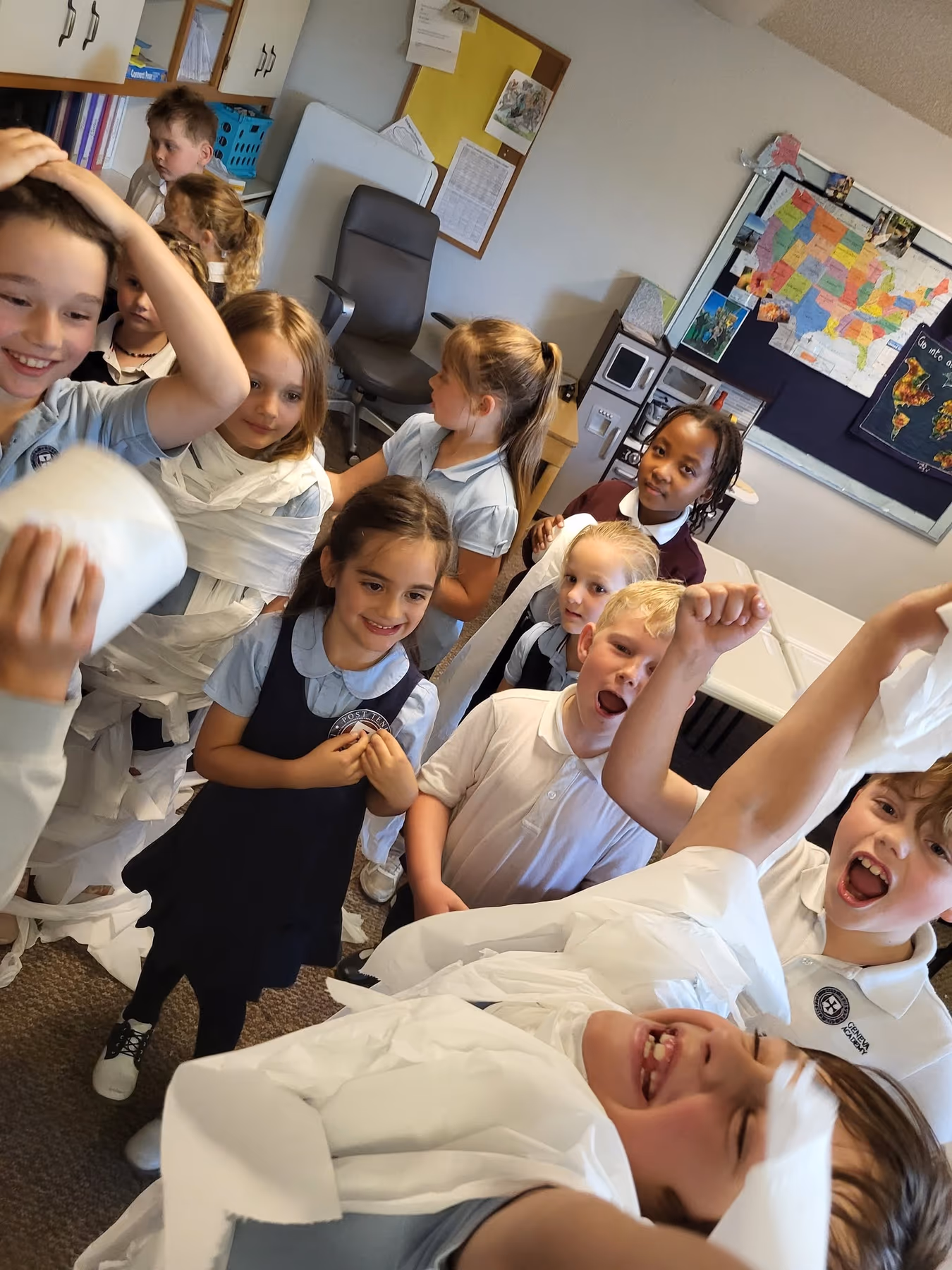Geneva Academy grammar students enjoying a lighthearted classroom activity in Roseburg, Oregon