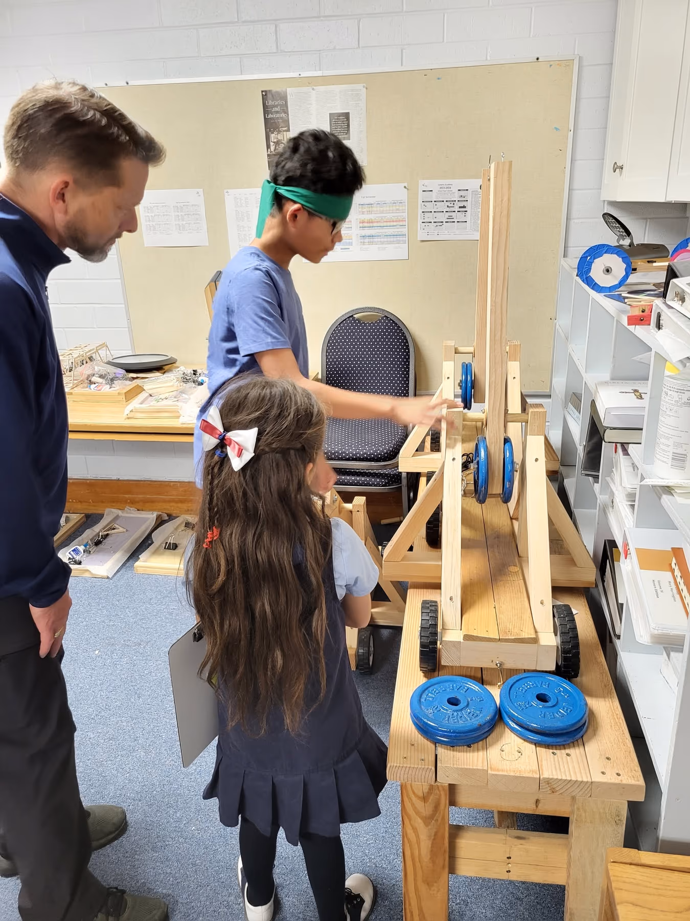 Geneva Academy students testing a pulley-and-cart engineering project in Roseburg, Oregon
