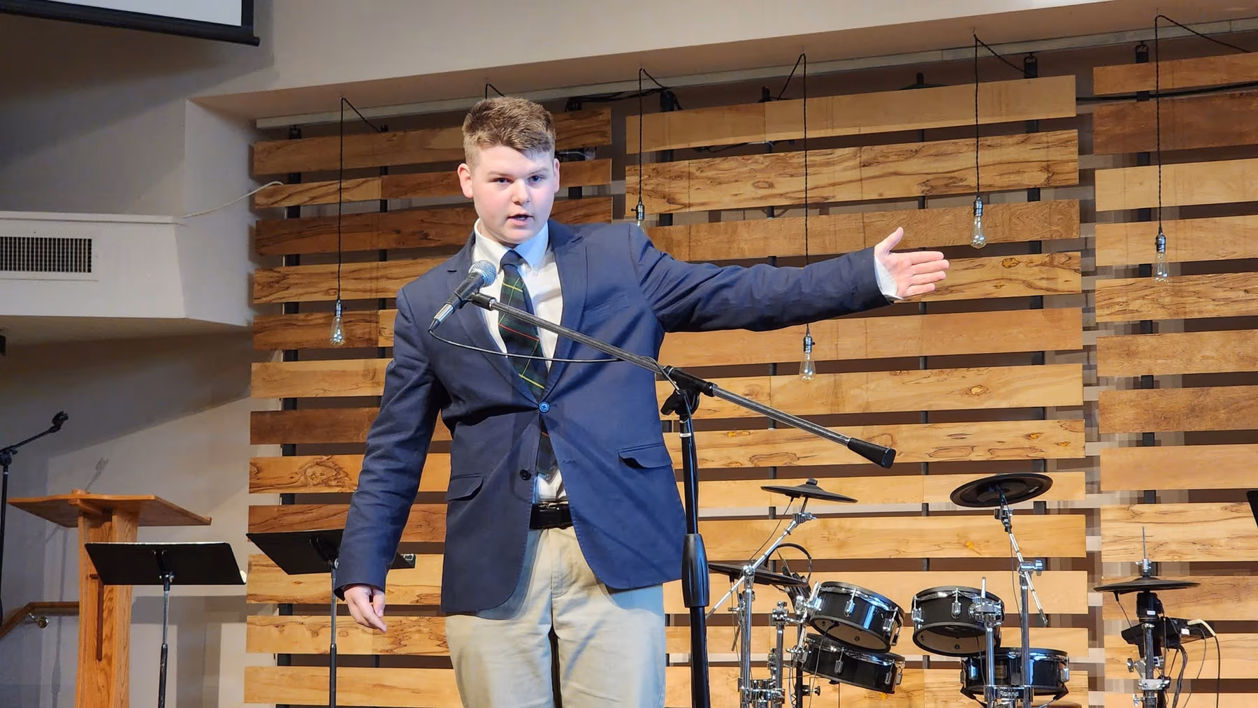 A Geneva Academy student presenting work in a classical Christian classroom