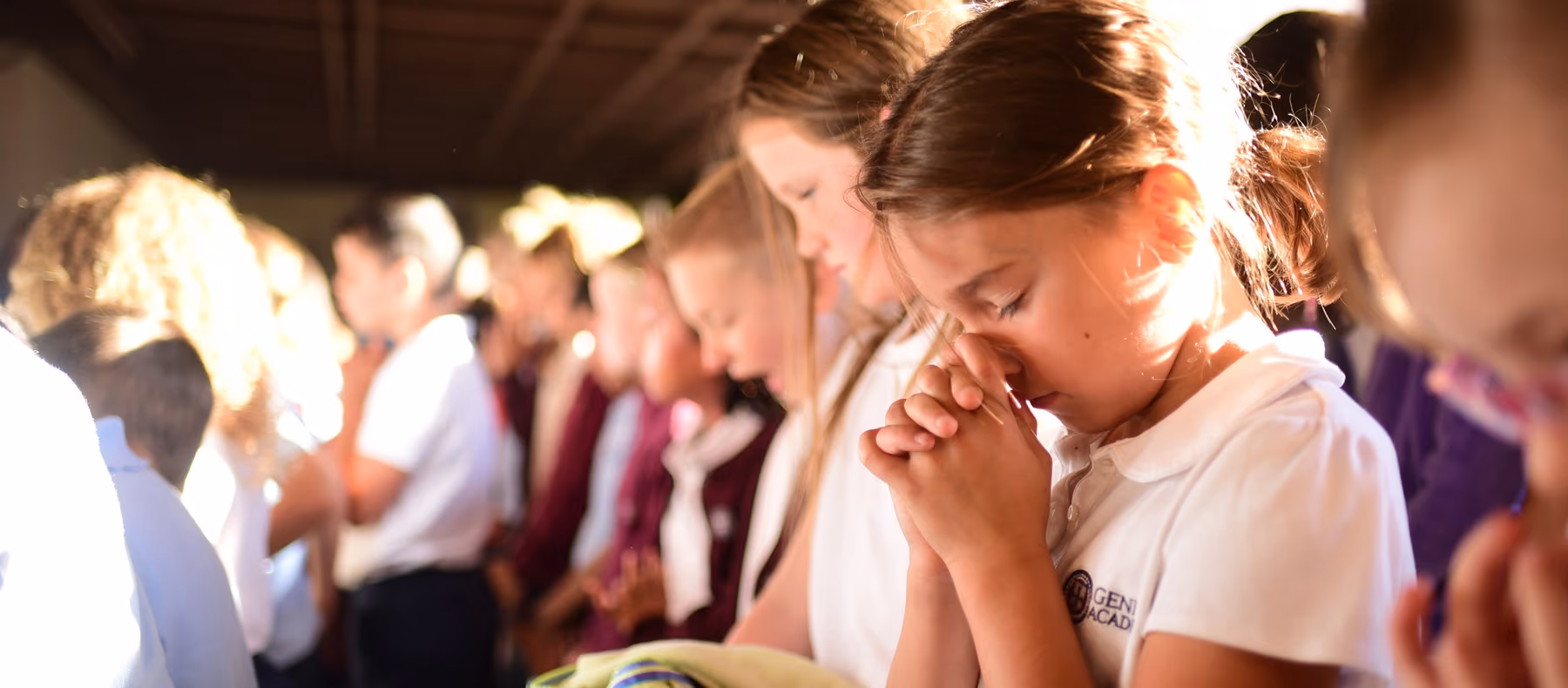 Geneva Academy students bowed in prayer during chapel in Roseburg, Oregon